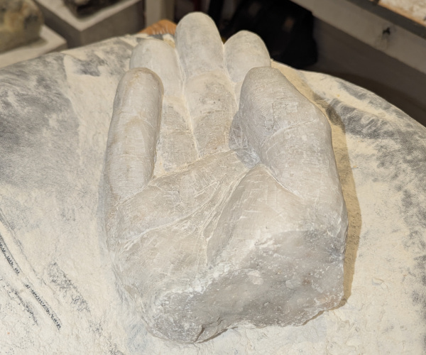 a sculpture depicting a hand